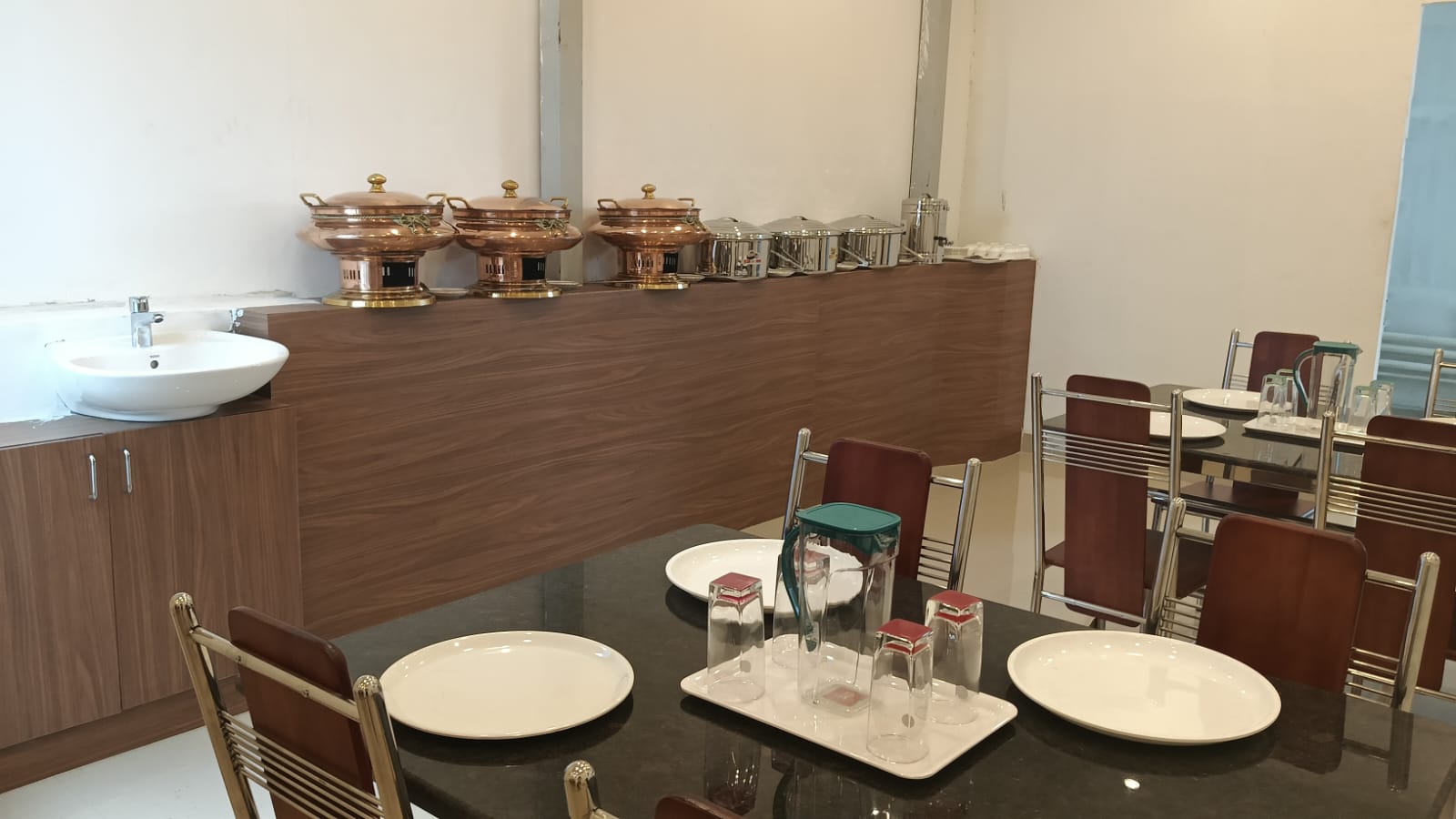 Bright Urban Stay dining room with tables and chairs